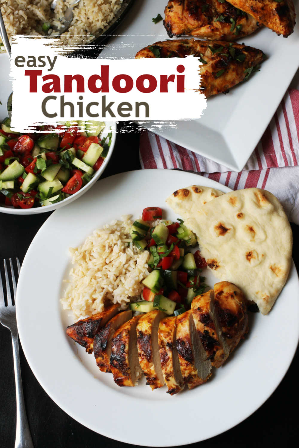 A plate of chicken, rice, and naan