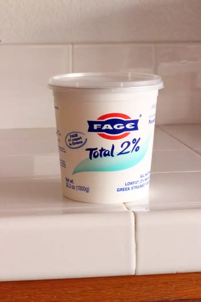 large carton of yogurt on counter