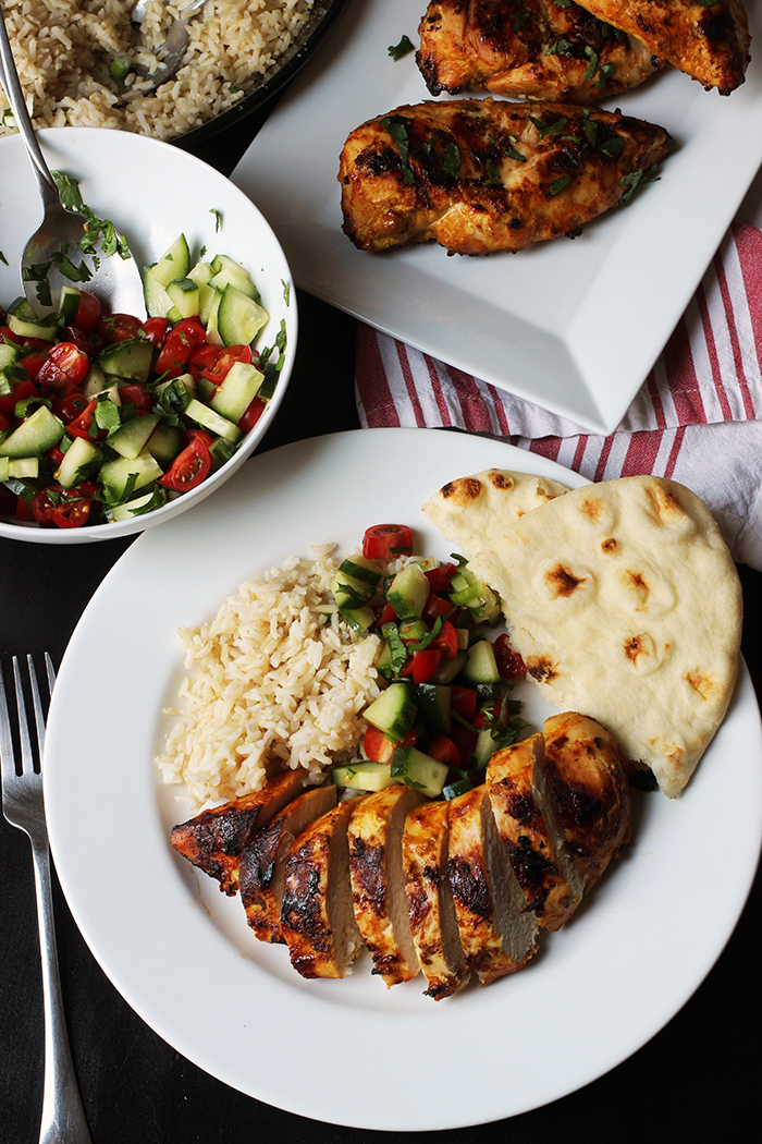 tandoori chicken plate with side dishes