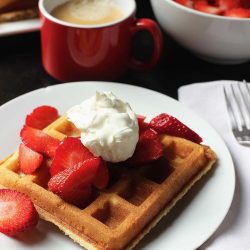 breakfast table with waffles and berries