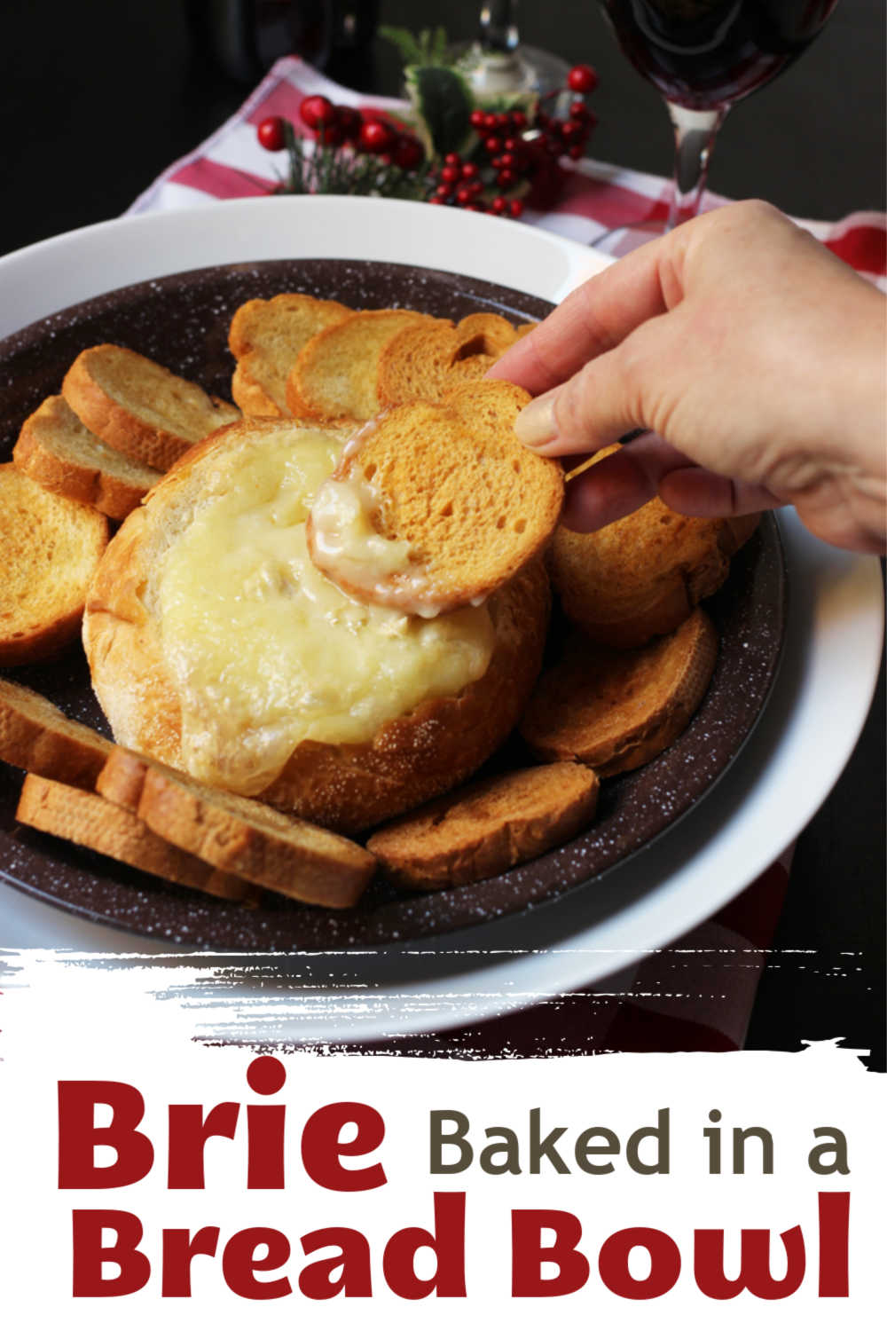a bread bowl of melted brie with bread dippers