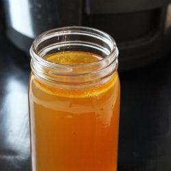jar of chicken stock with slow cooker