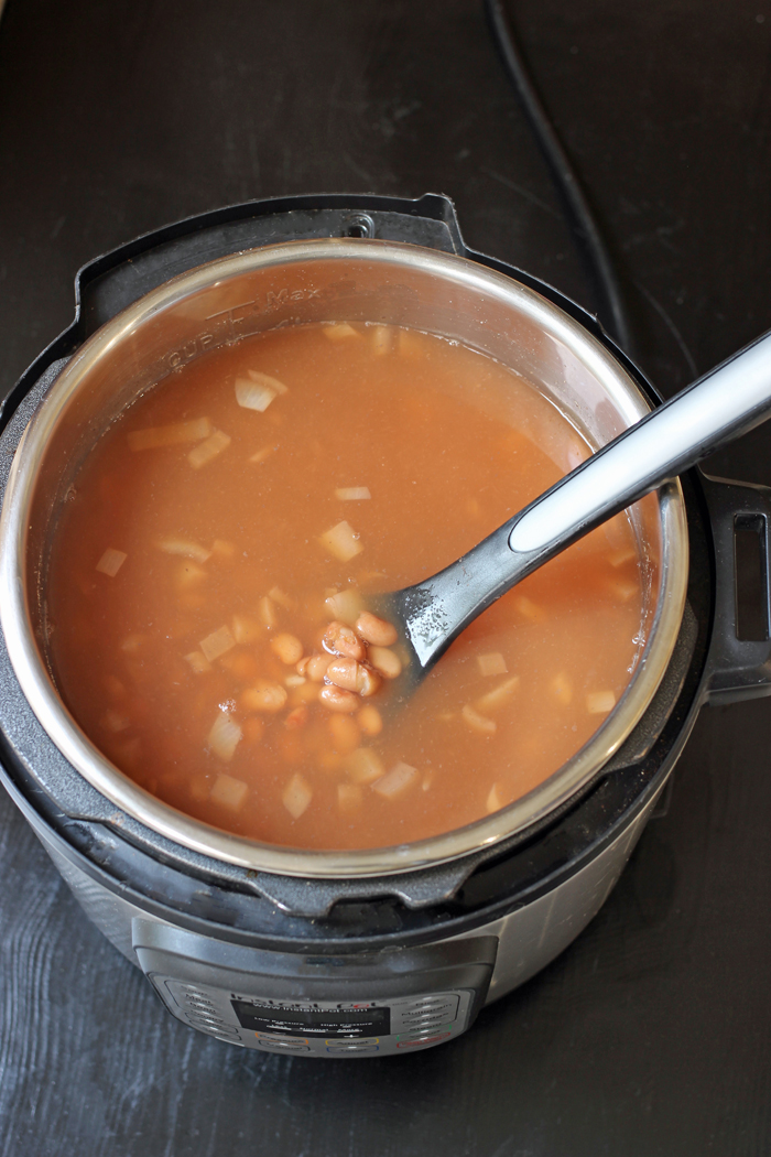 pinto beans cooking in pressure cooker