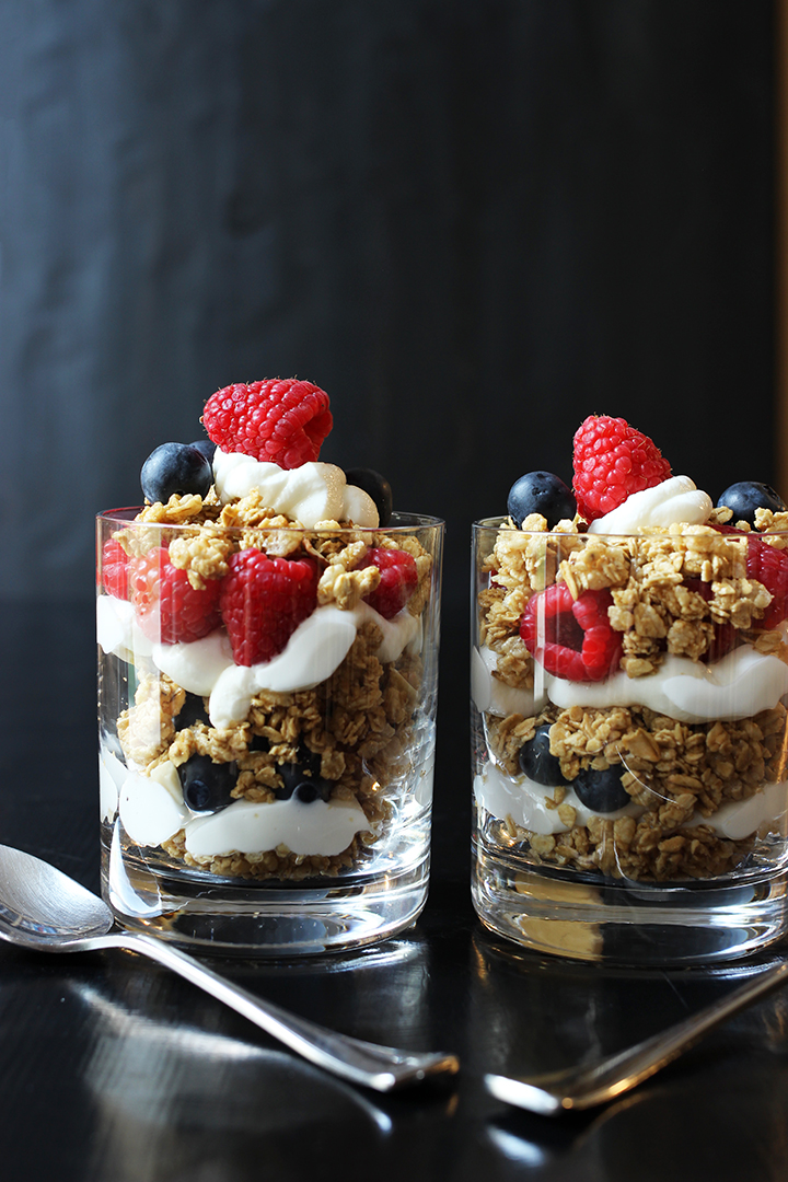 two yogurt berry parfaits in glasses