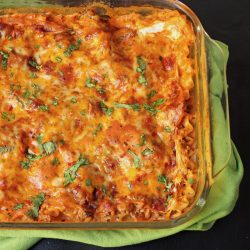 casserole of mexican lasagna on green cloth