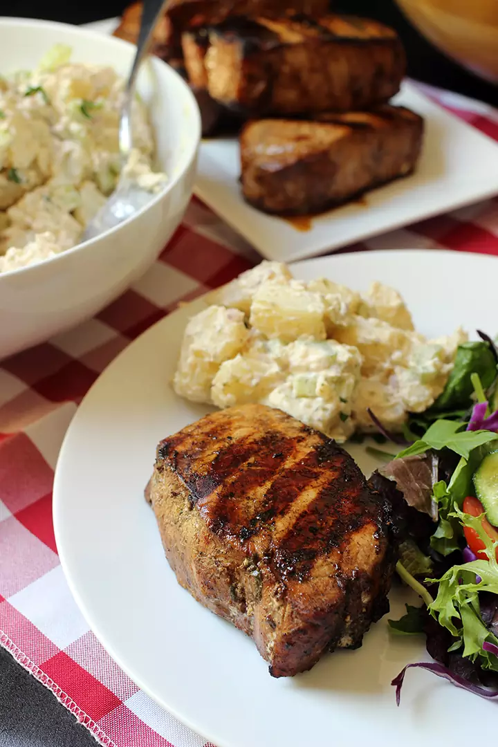 grilled balsamic pork chop on dinner plate