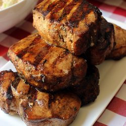 stack of grilled pork chops on rectangle platter