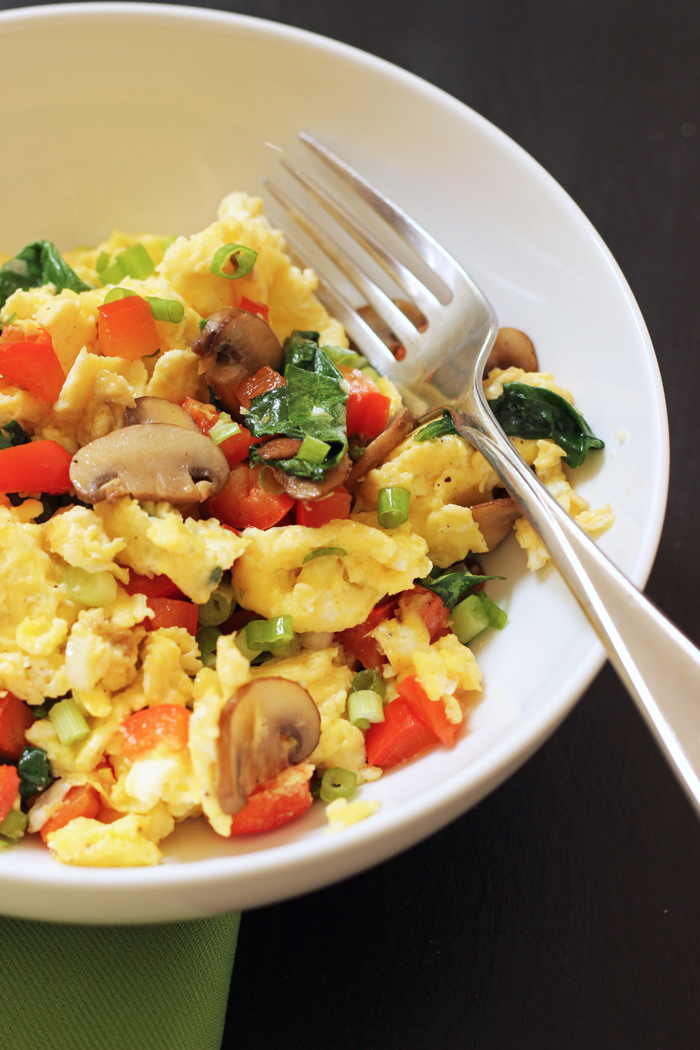 white ceramic bowl of meatless greek eggs with fork