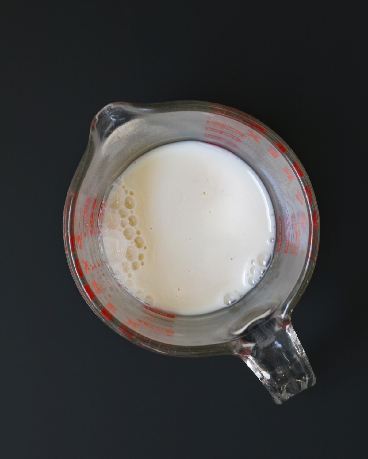 milk in glass pitcher.