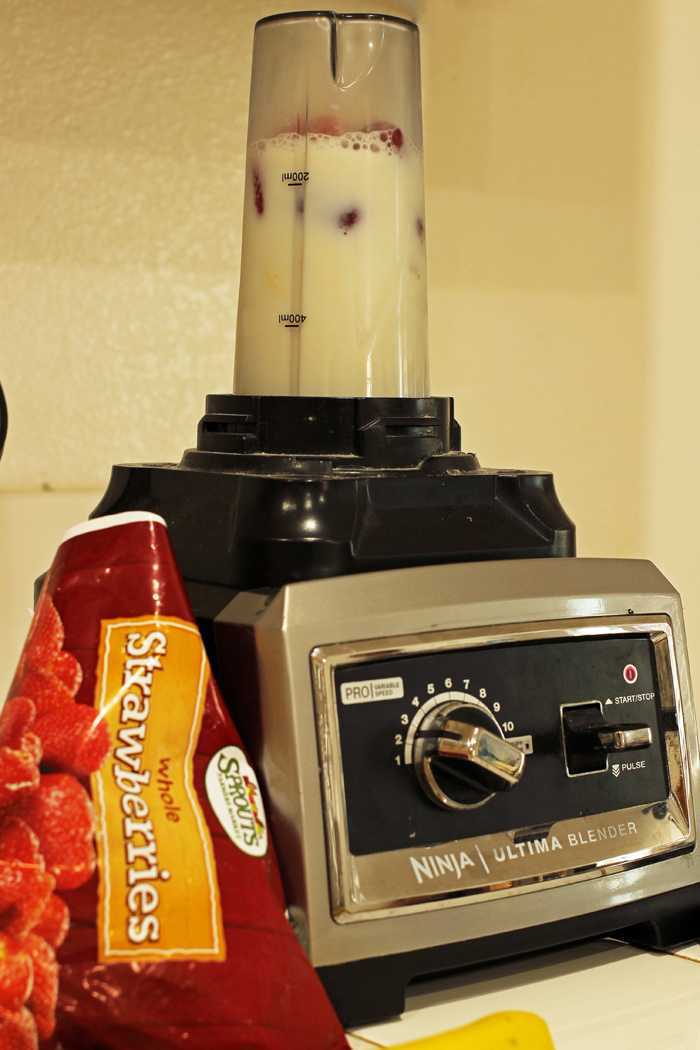 red banana smoothie in blender cup