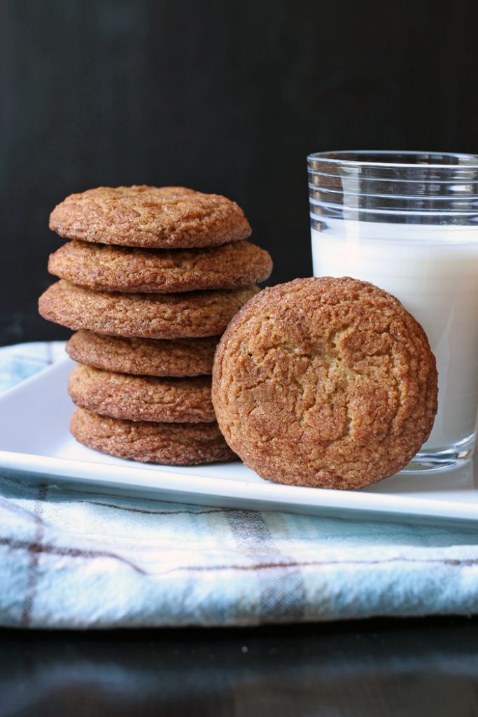 A plate of Snickerdoodle, with glass of milk