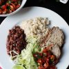 dinner plate with cumin pork loin with rice and beans