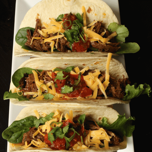three tacos on tray