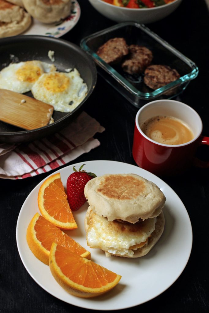 breakfast sandwich with table spread