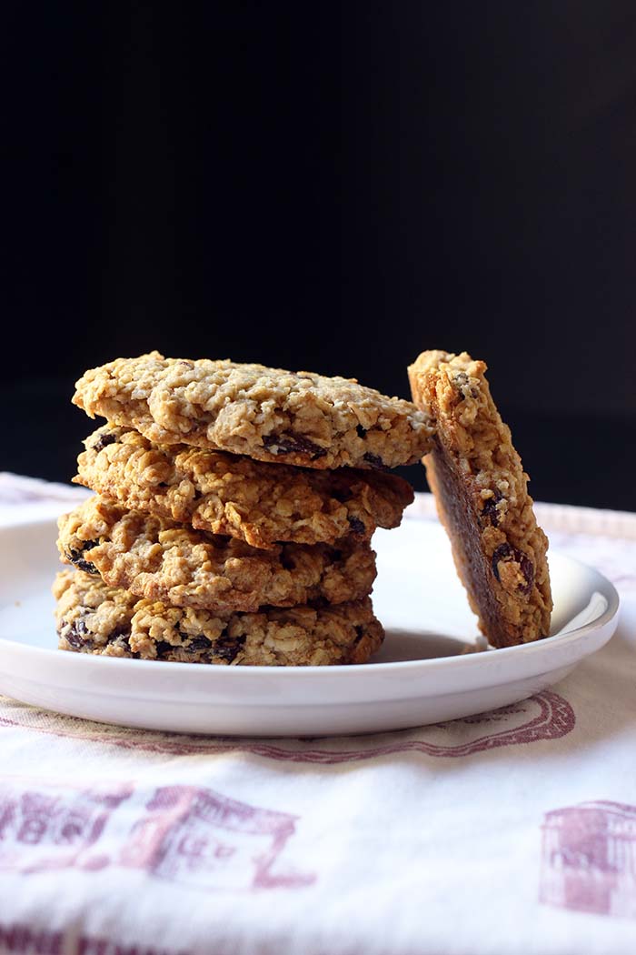 cookie leaning against stack of cookies on plate