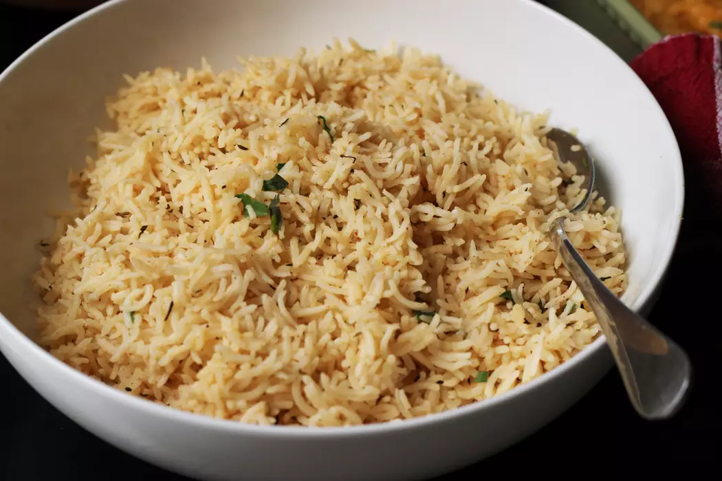 A bowl of rice with a spoon