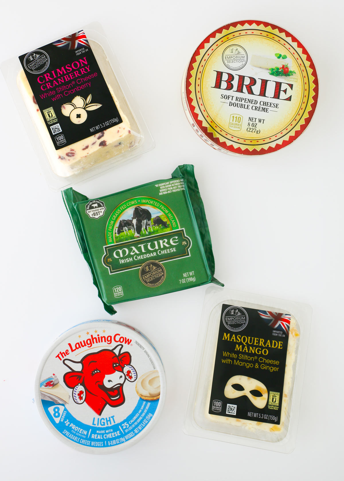 array of different types of cheese on counter.