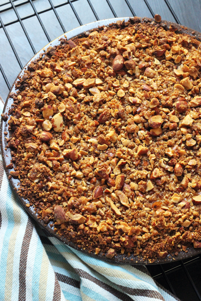whole pumpkin streusel pie on a cooling rack