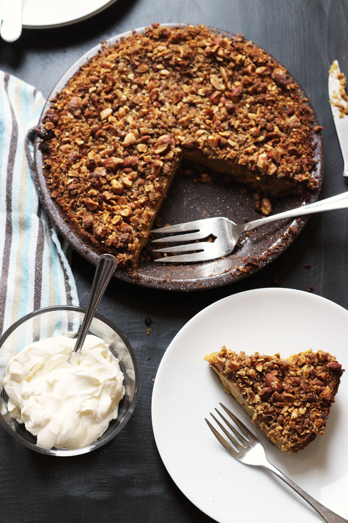 Streusel-Topped Pumpkin Pie with as slice on a plate