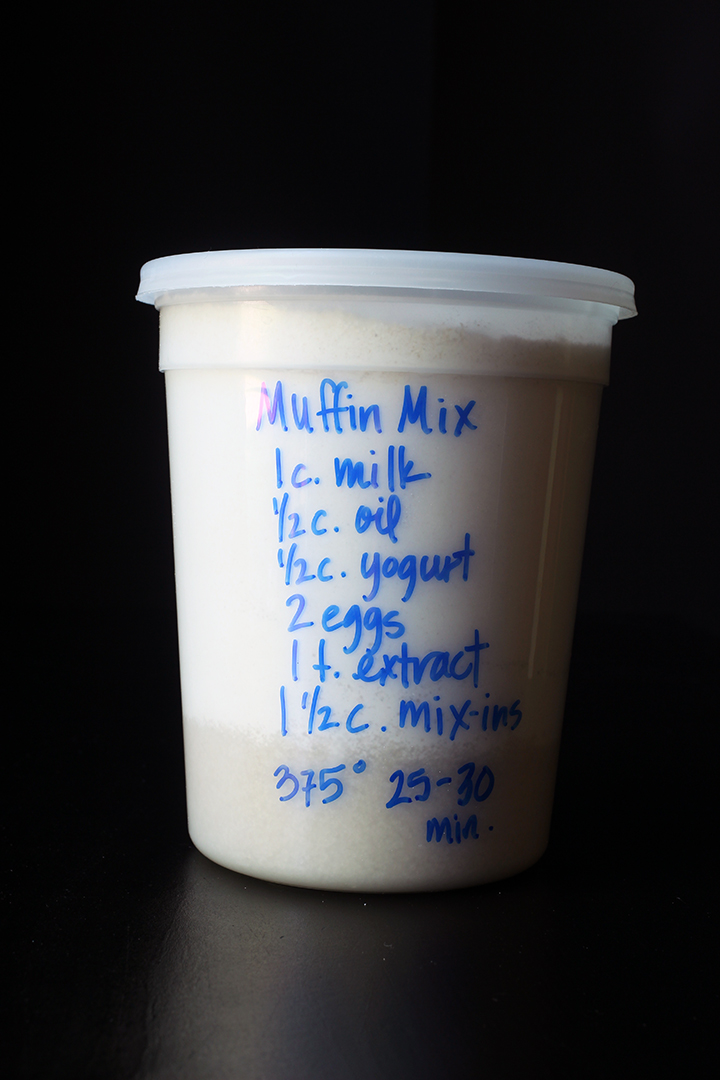 muffins in plastic tub with blue writing