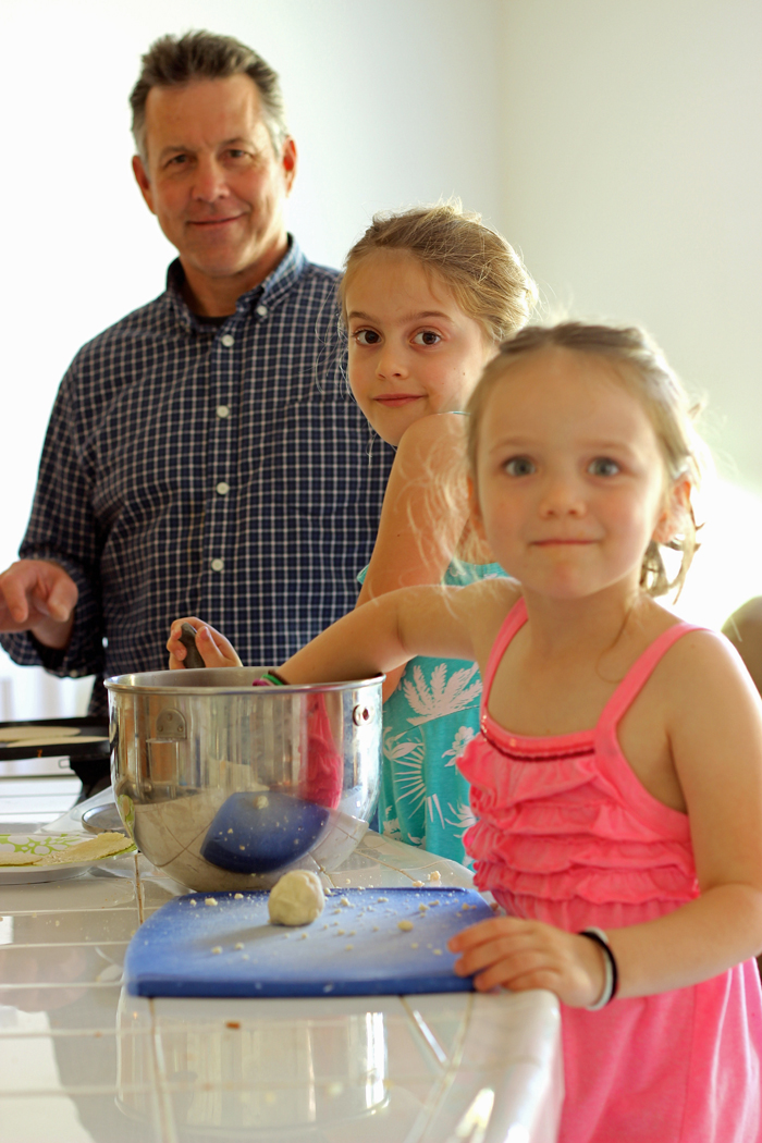 dad and girls making tortillas