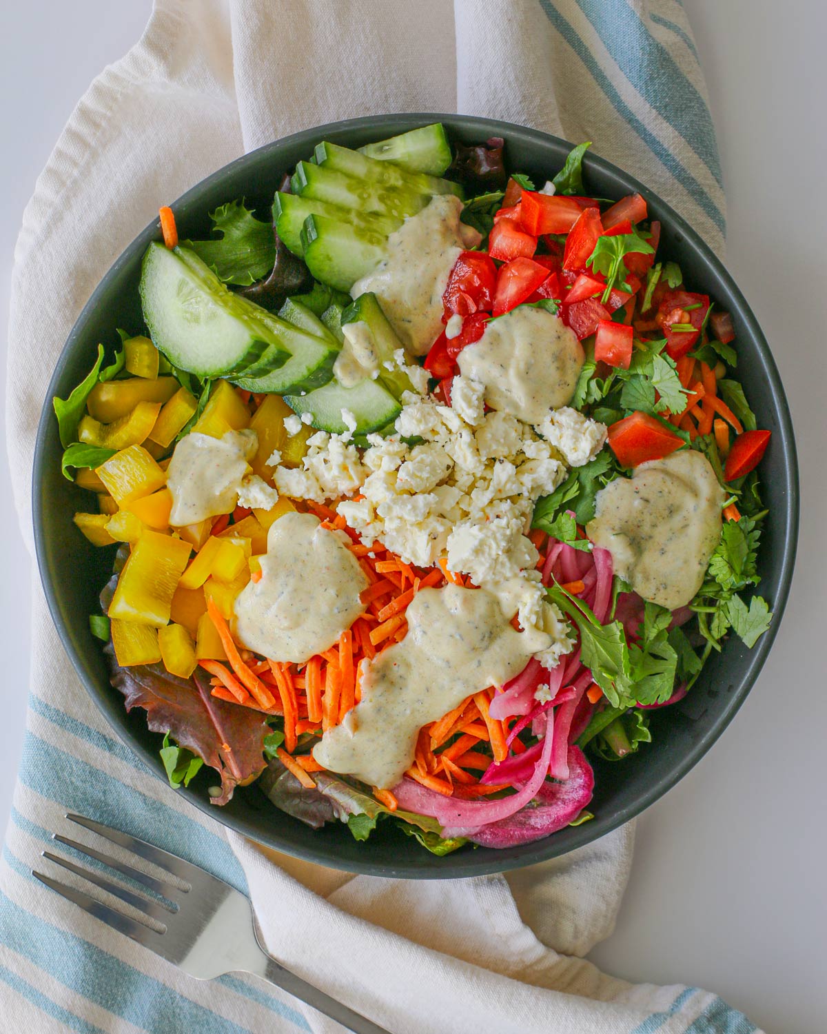 salad topped with greek yogurt salad dressing.