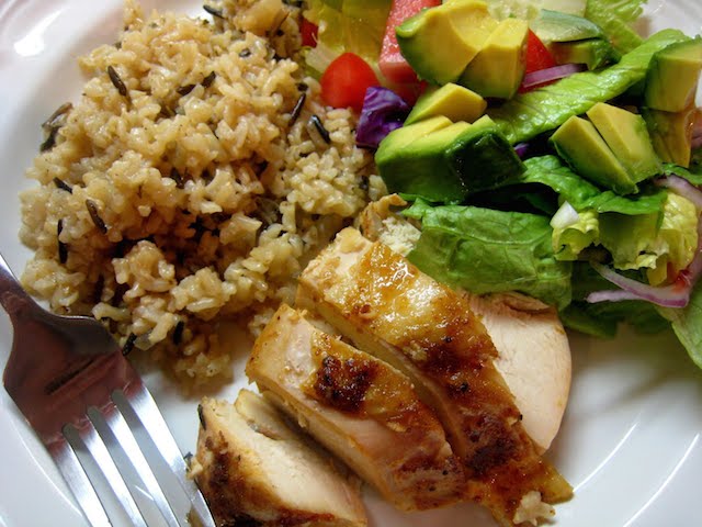 A plate of food with Chicken and rice