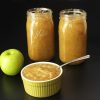 Apple and jars and bowl of Sauce