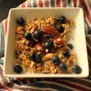 maple granola in bowl with blueberries