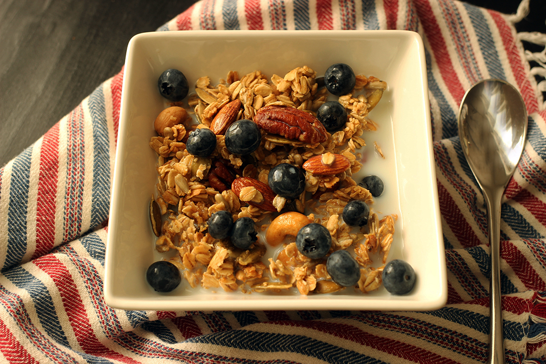 maple granola in bowl with blueberries