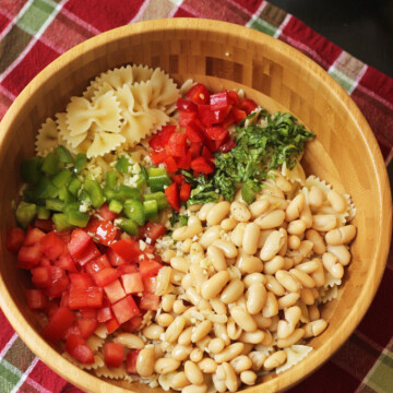 A bowl of beans and pasta salad ingredients