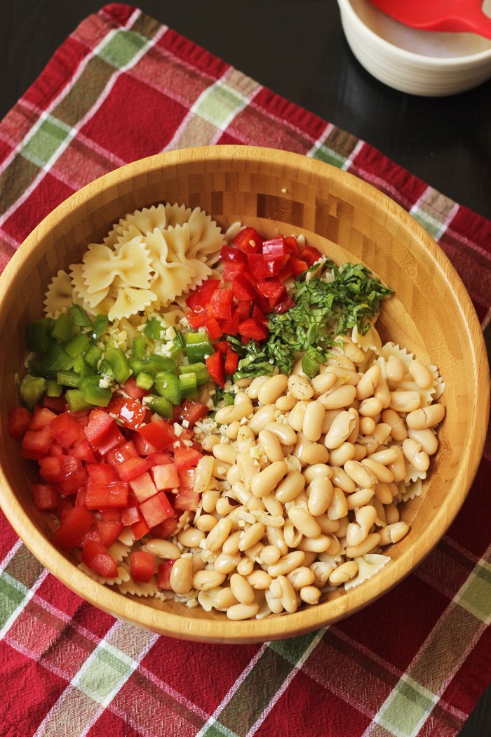 A bowl of beans and pasta salad ingredients