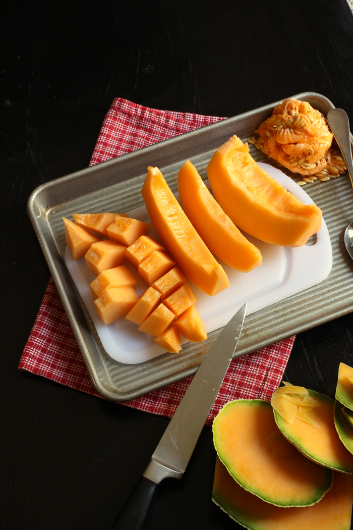 cutting cantaloupe for fruit tray