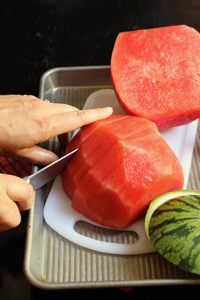 cutting cantaloupe for fruit tray