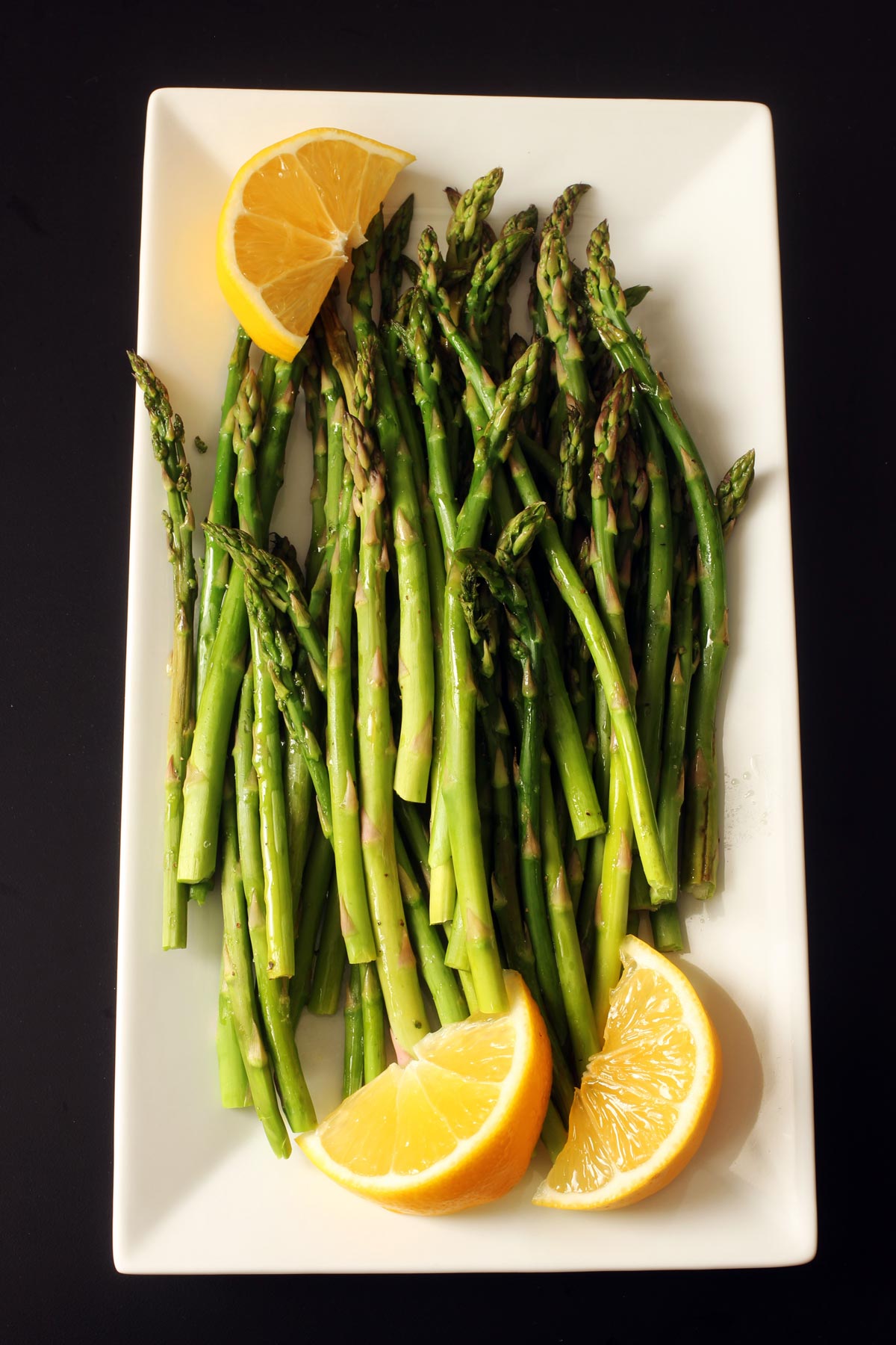 platter of asparagus with lemon