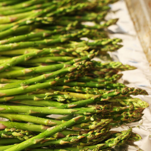 roasted asparagus on baking sheet
