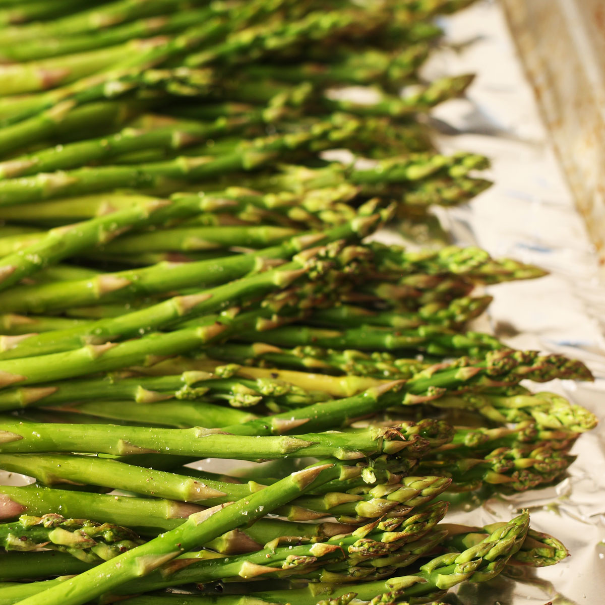 roasted asparagus on baking sheet
