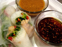summer rolls on plate with dipping sauces