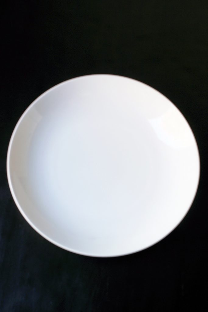 large empty white salad bowl.