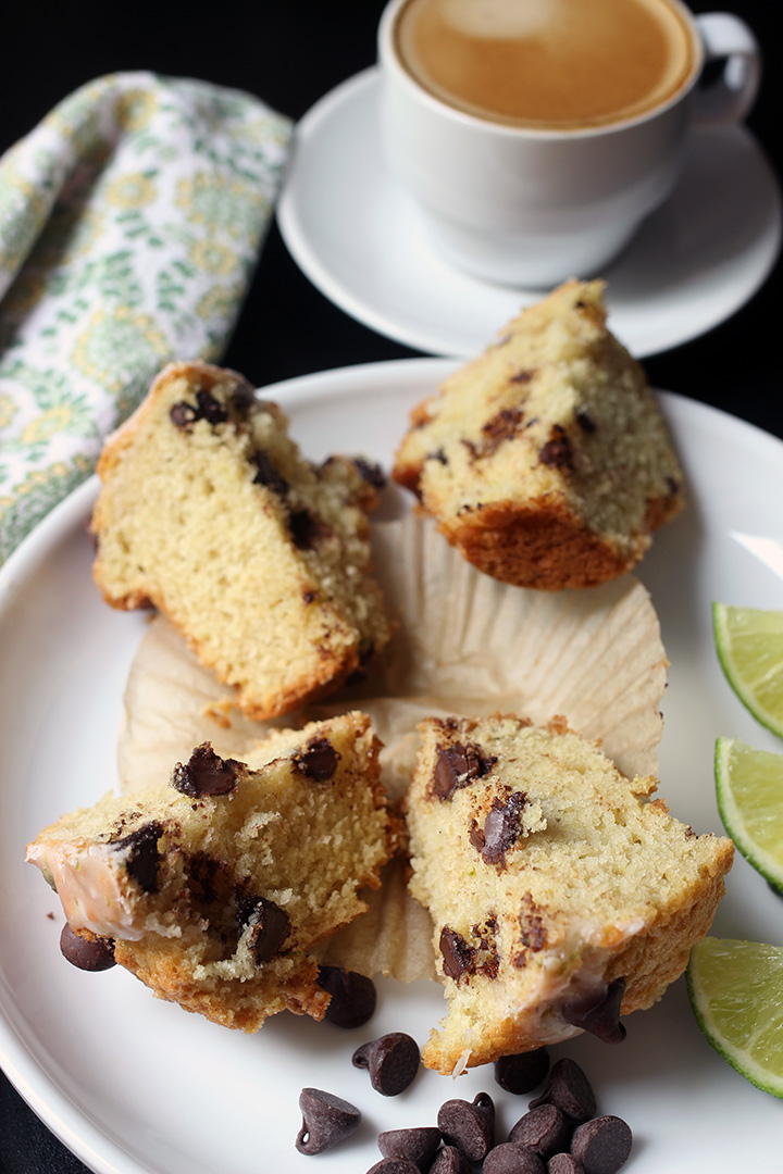 chocolate chip muffin cut in quarters on a white plate