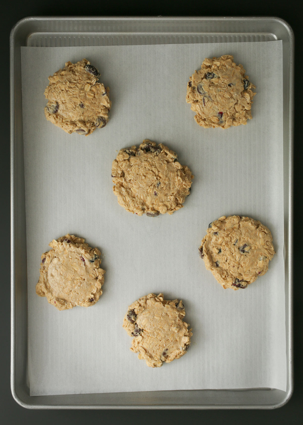 flattened cookies on parchment.