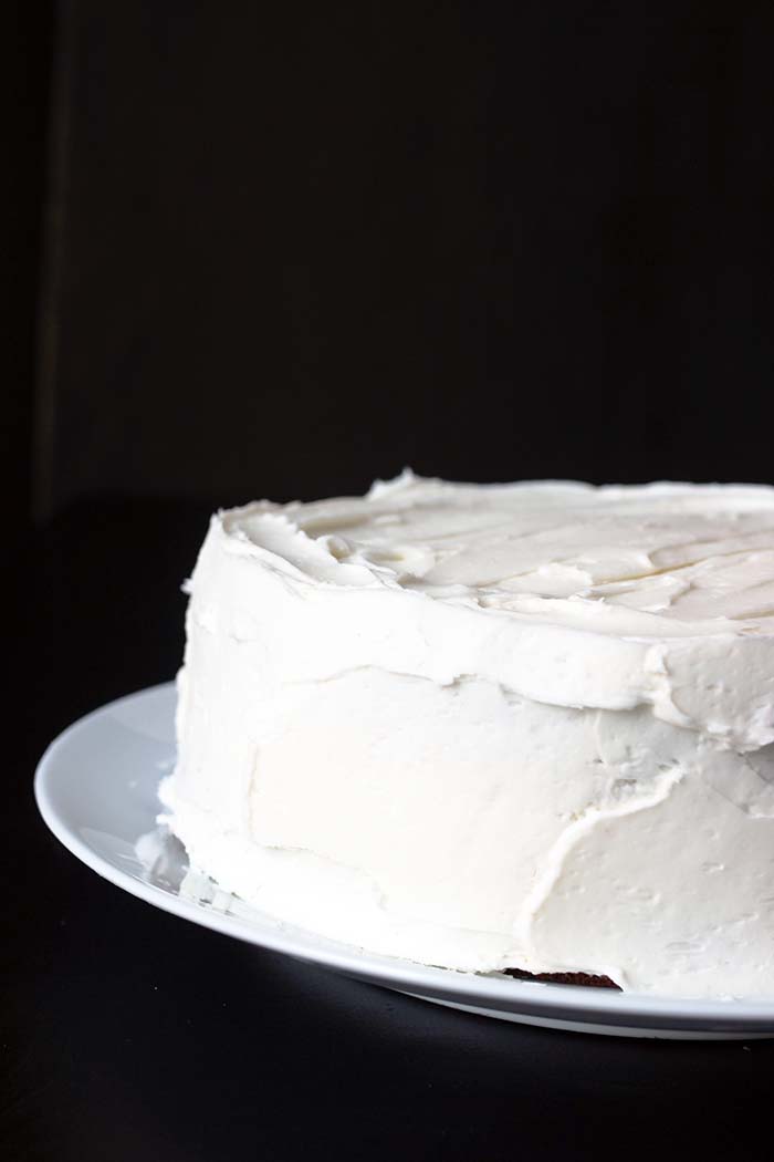 white layer cake with white buttercream frosting