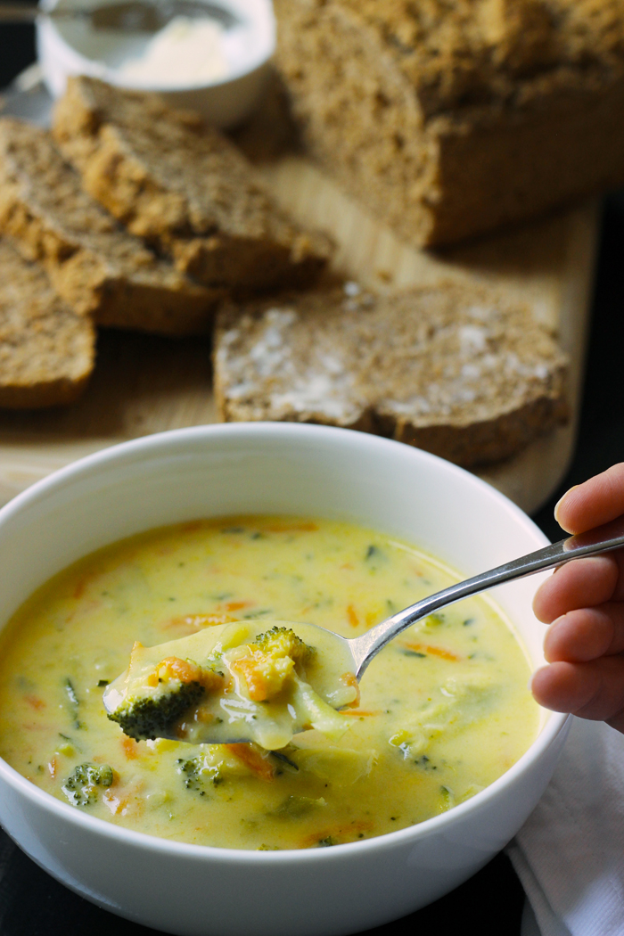 bowl of cheddar cheese soup with bread