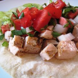 a plate of chicken tacos