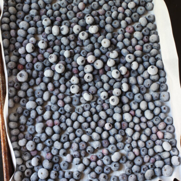 frozen blueberries on a lined tray