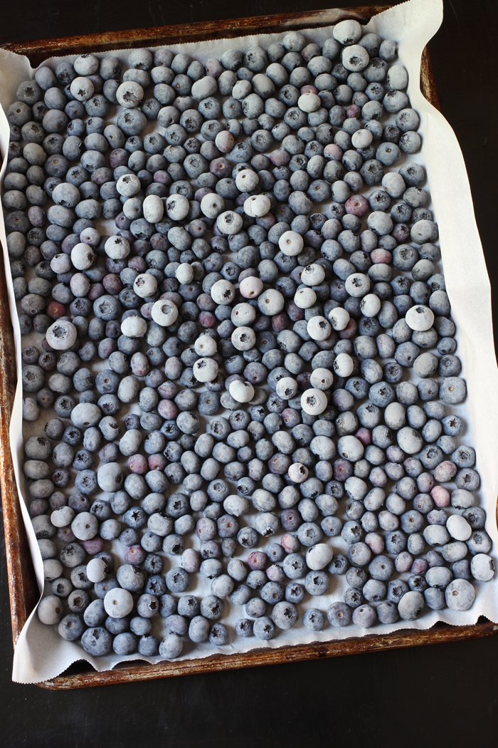 frozen blueberries on a lined tray