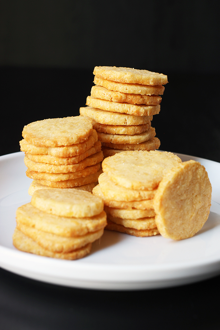 stack of cheddar cracker coins on white plate