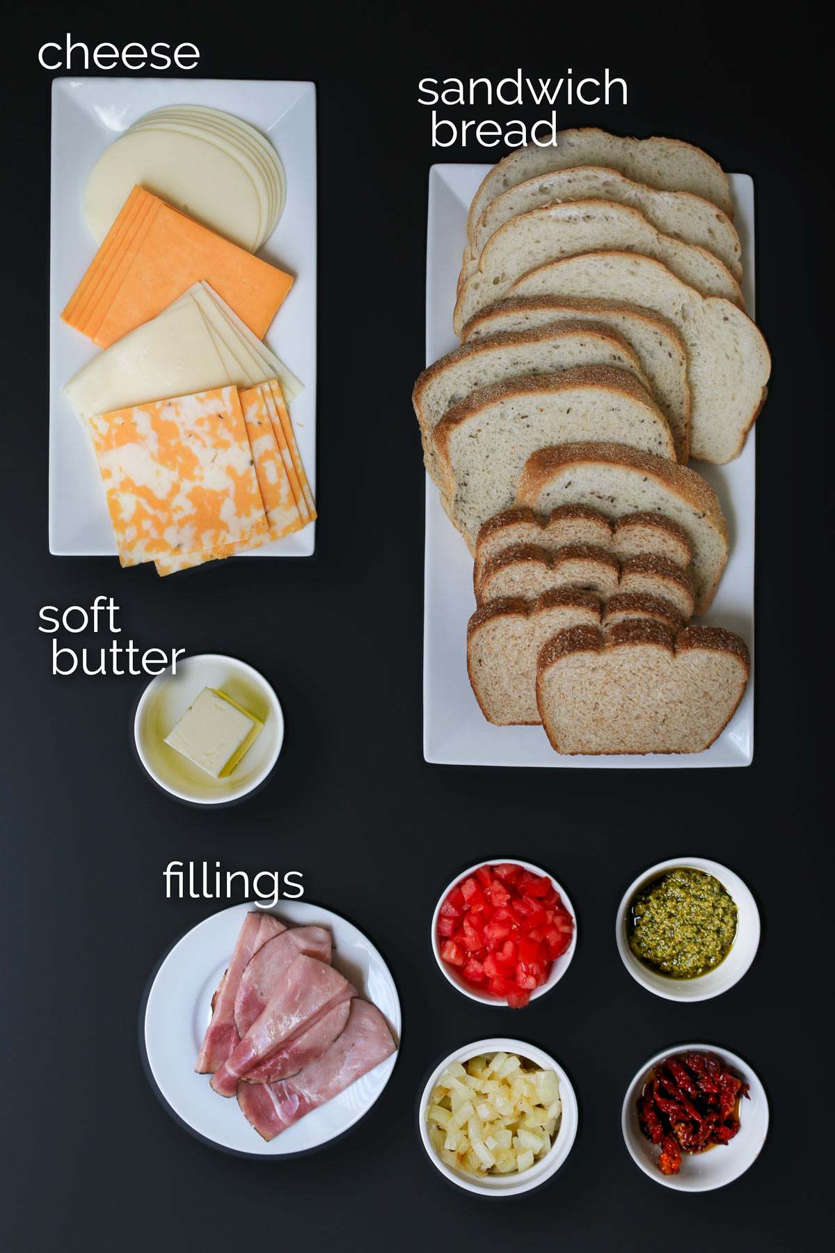 ingredients for air fryer grilled cheese sandwiches on black table.
