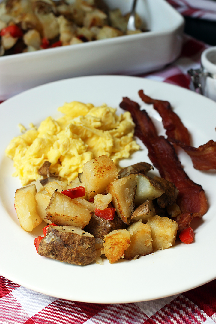 plate of home fries eggs and bacon
