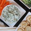 healthy spinach dip with veggies and crackers